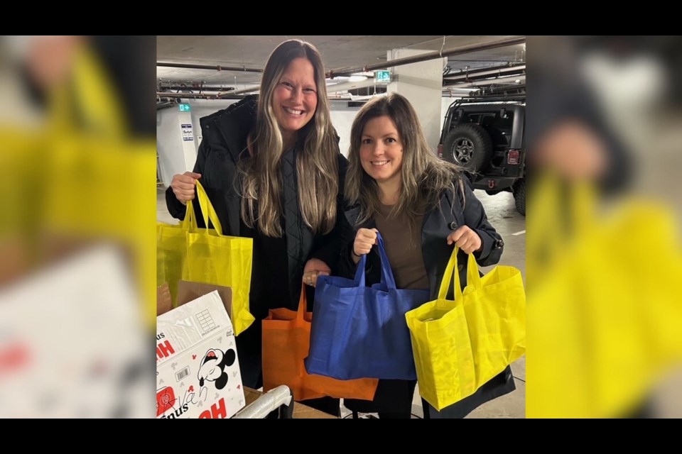 Rose's Angels co-founder Courtney Cohen (left) and May Stefanov, tenant relations coordinator with Tikvah Housing Society.