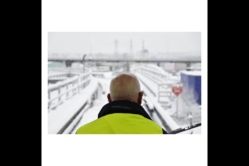 Canada Line attendants watch for debris on the track as sensors are turned off on snowy days.
