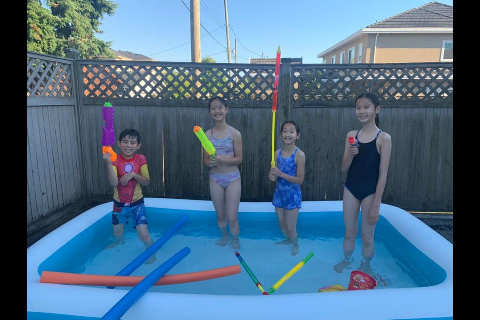 Gearing up for water fights for the Yang family.