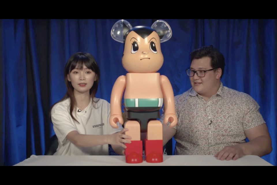 Patrick (right) and Yvonne (left) from YKLM are unboxing and reviewing Bearbricks. 