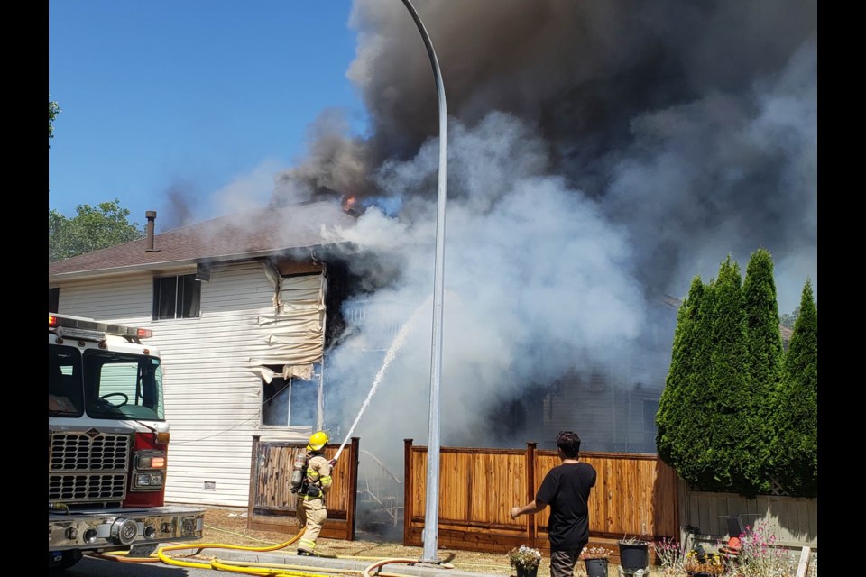 A fire lit up the entire backside of an East Richmond home on Sunday.