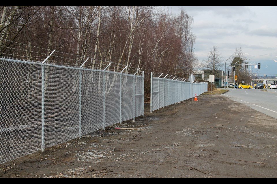 Canada's Department of National Defence is constructing a fence around its lands in Richmond, just over two years after a large fire ravaged the peat woodland area.