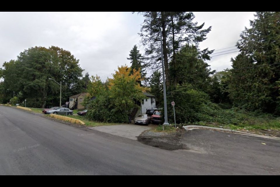 Trees and single-family homes are currently on a property that was going to see a hotel and condo development.