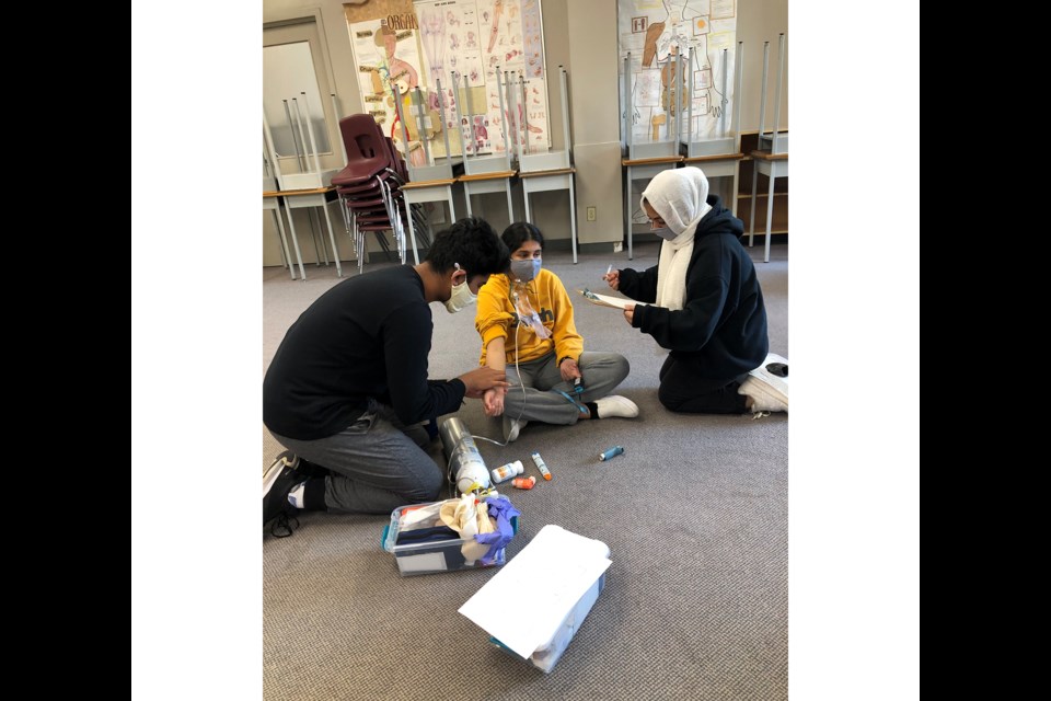 Students learning how to check vitals during Cambie secondary's new medical science program. Submitted photo by Sarah Ardat