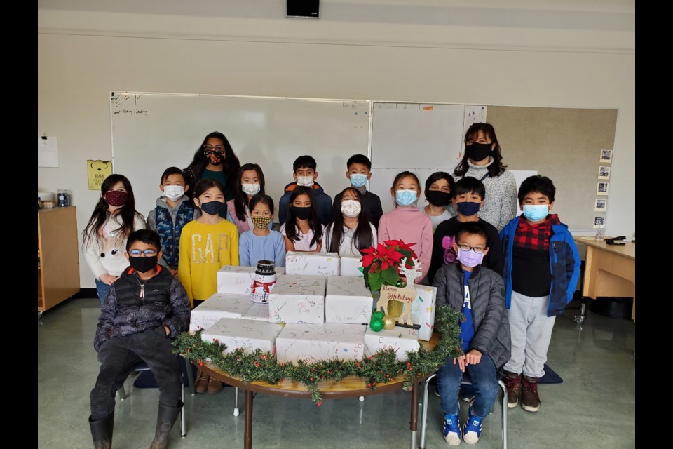 The Grade 3 Grauer elementary students who packaged the family fun boxes.