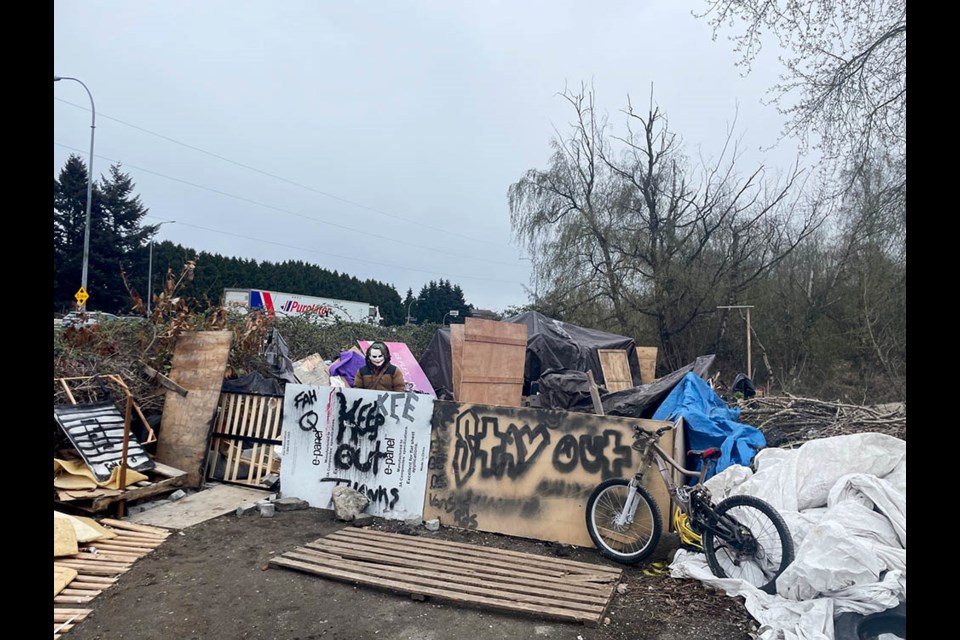 People use what they find to build shelters to stave off the cold weather in Richmond.