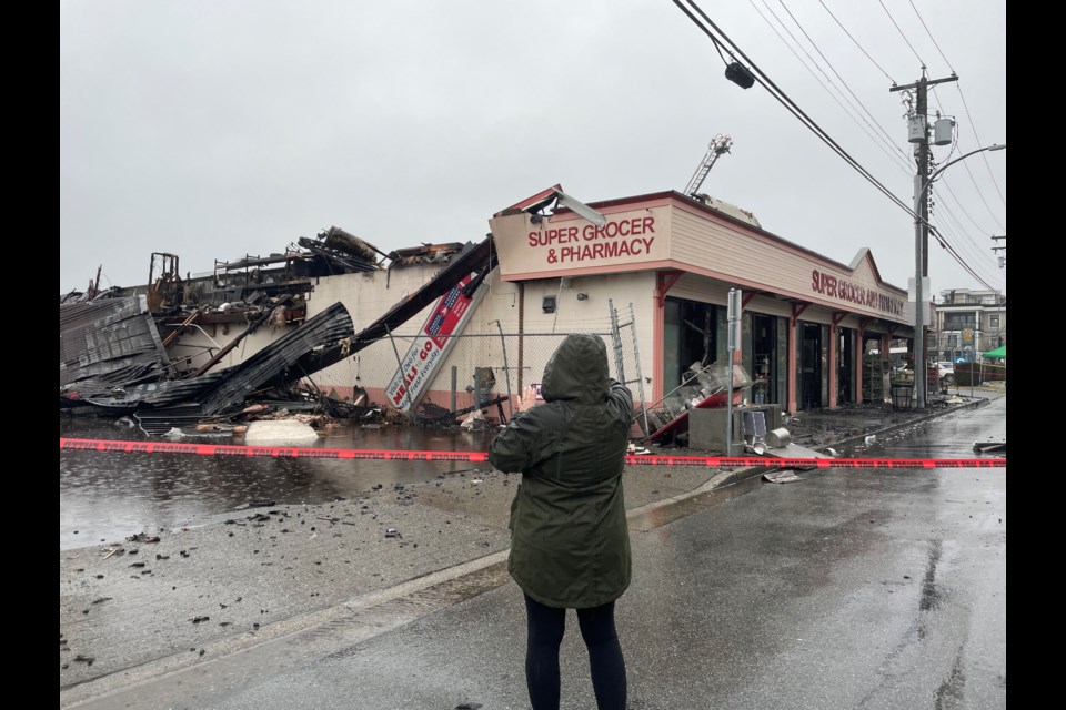 Community members gathered to mourn the loss of Super Grocer & Pharmacy in Steveston.