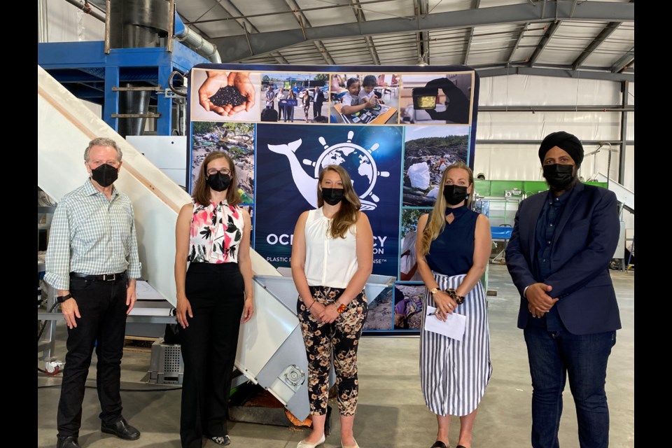 B.C. Environment Minister George Heyman posing with Aman Singh, MLA for Richmond-Queensborough, Kelly Greene, MLA for Richmond Steveston, and Chloe Dubois, executive director of Ocean Legacy.