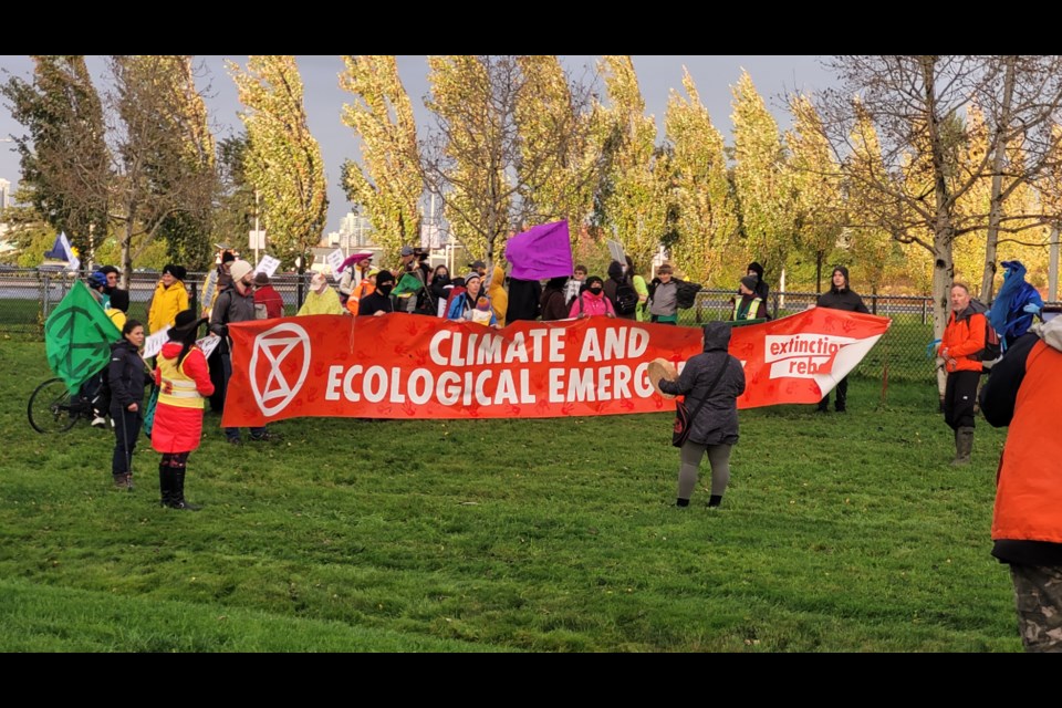 Richmond  RCMP have blocked off an intersection at YVR airport  In preparation for a environmental activist group protest.