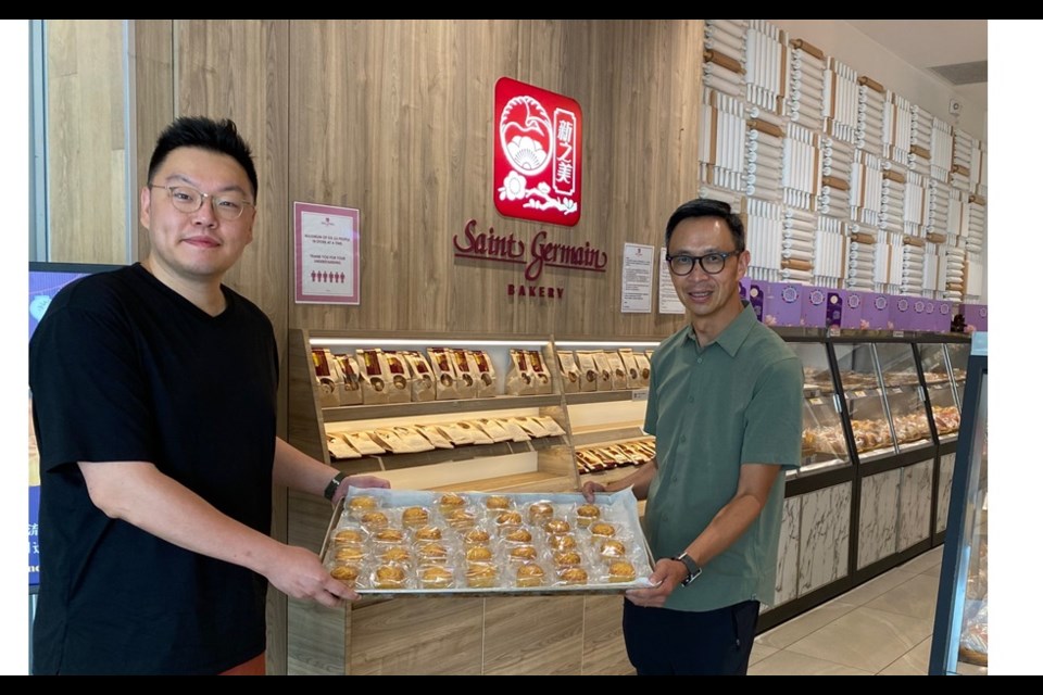 Saint Germain Bakery's Alex Ma (left) and Richmond News Publisher Alvin Chow getting ready for Mid-Autumn Festival.