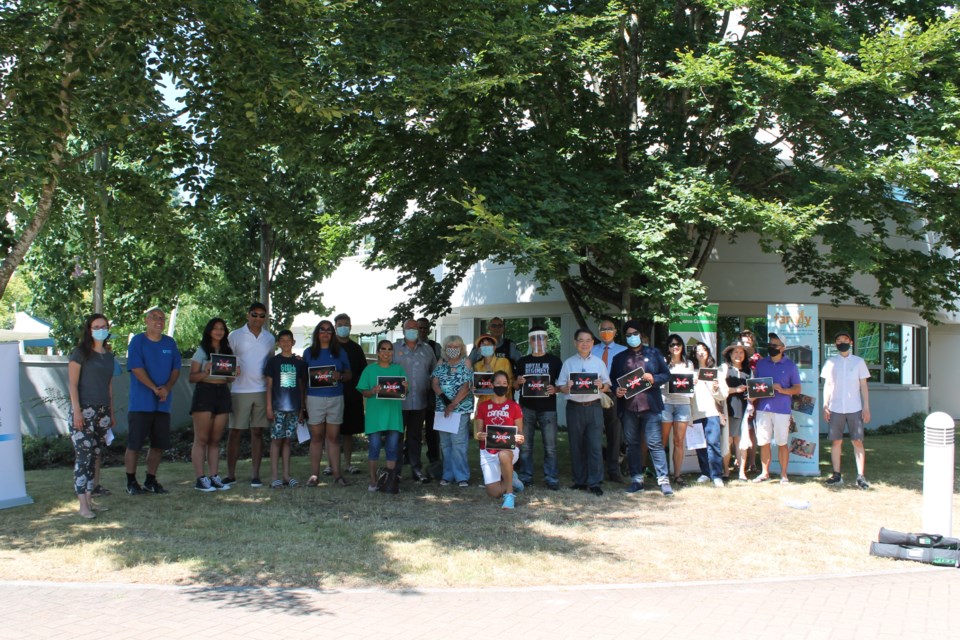 An anti-racism car rally was held to support Resilience BC's Nanaimo branch, which received racist threats.