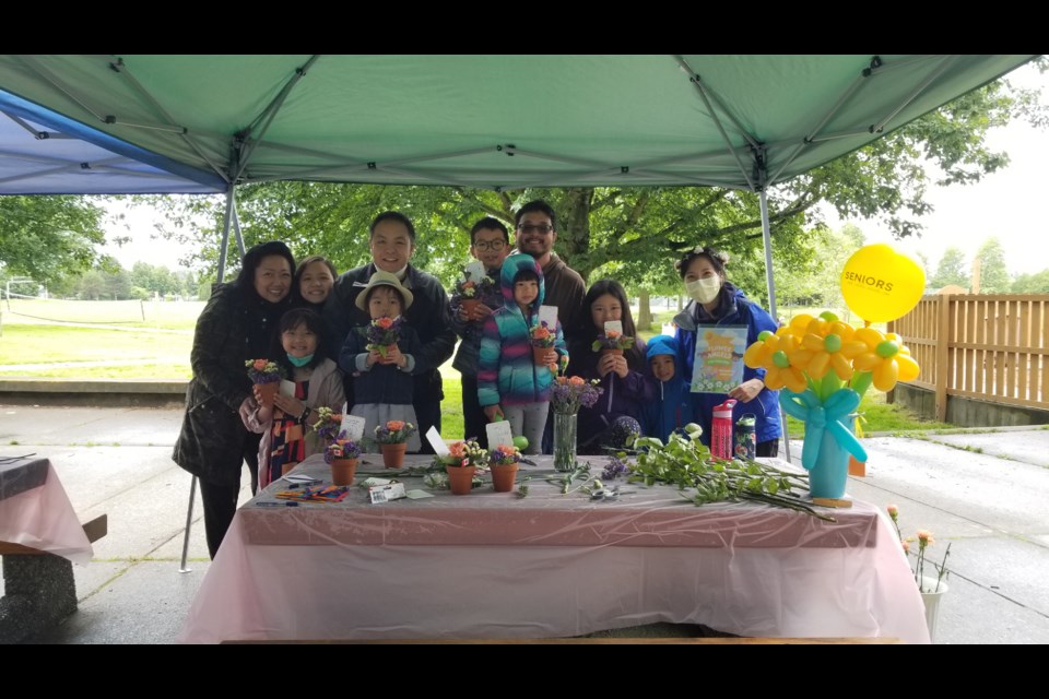 Richmond resident Jane Lee (far right) hosted a flower arrangement workshop for community members, which the flowers were then delivered to local seniors.