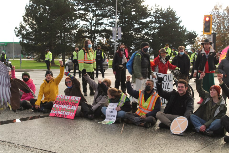 A group of protesters with Extinction Rebellion Vancouver blocked a major intersection leading to Vancouver International Airport while calling for an end to subsidies in the fossil fuel industry.