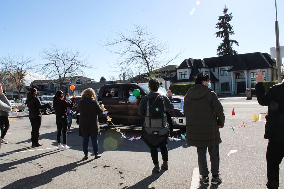 Several McNair students presented signs and origami cranes to Jenny Bitter during a drive by parade.