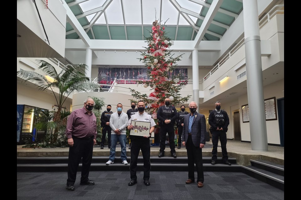 Ed Gavsie, CEO of Richmond Cares, Richmond Gives "named" a star after the Richmond RCMP and gifted the certificate during the final toy donation from the RCMP toy drive. Photo: Ed Gavsie/TWITTER