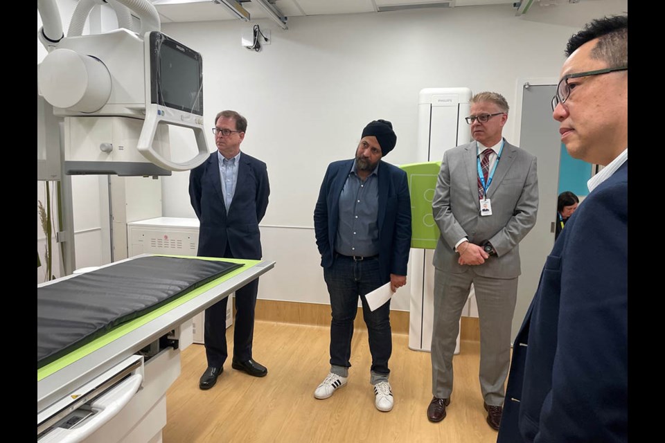 Health Minister Adrian Dix and Richmond-Queensborough MLA Aman Singh were touring the new UPCC; here they're in the medical imaging room which will come online in late July.