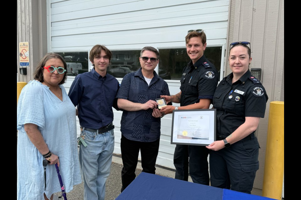 Richmond resident Nick Rizzo (middle) was presented the Vital Link Award for performing CPR and saving the life of his wife, Angela Rizzo (left).