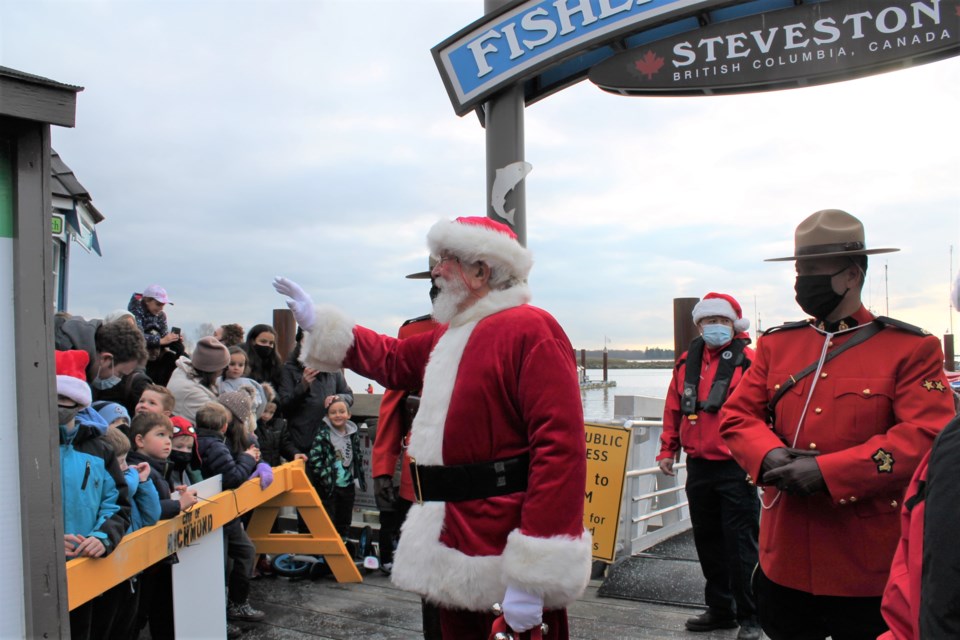 Santa Claus was welcomed by a crowd of families as he arrived at Fisherman's Wharf in Steveston on Dec. 5 after a 