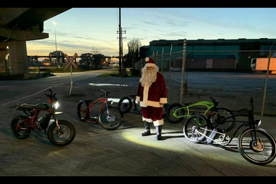 Justin Ruscheinski, a Richmond resident, was spotted cycling as Santa Claus. Photo: Ben Wong