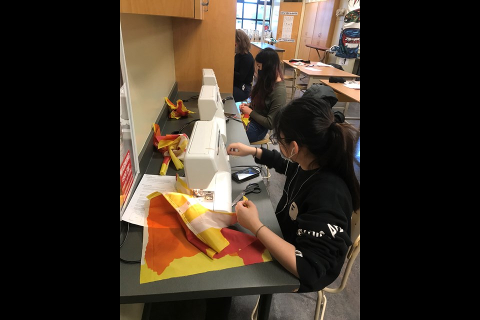 McMath textile students recycled old Richmond street banners to make reusable bags.