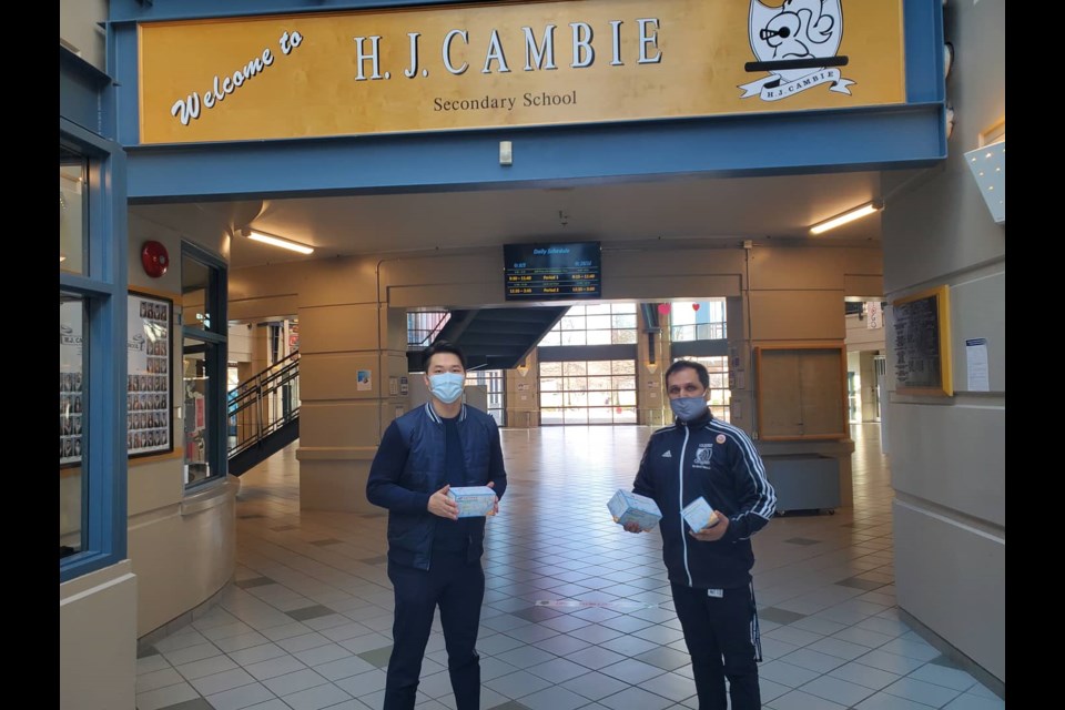 Franco Ng (left), president of YouthTalkNation, and Michael Jaswal, principal at HJ Cambie secondary.