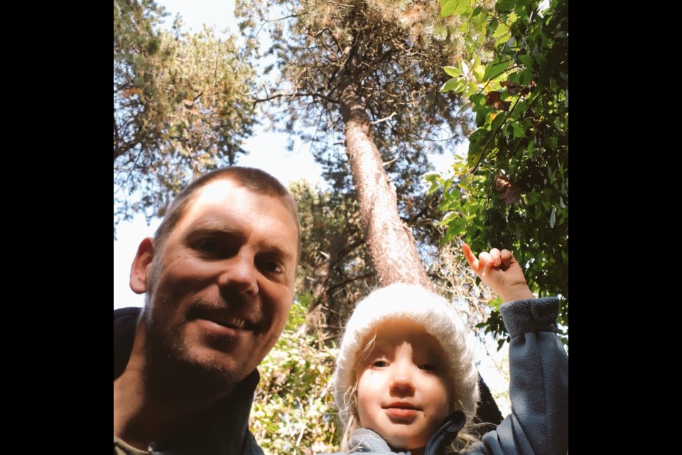 Coun. Michael Wolfe, who adopted the trail in 2015, and his daughter.