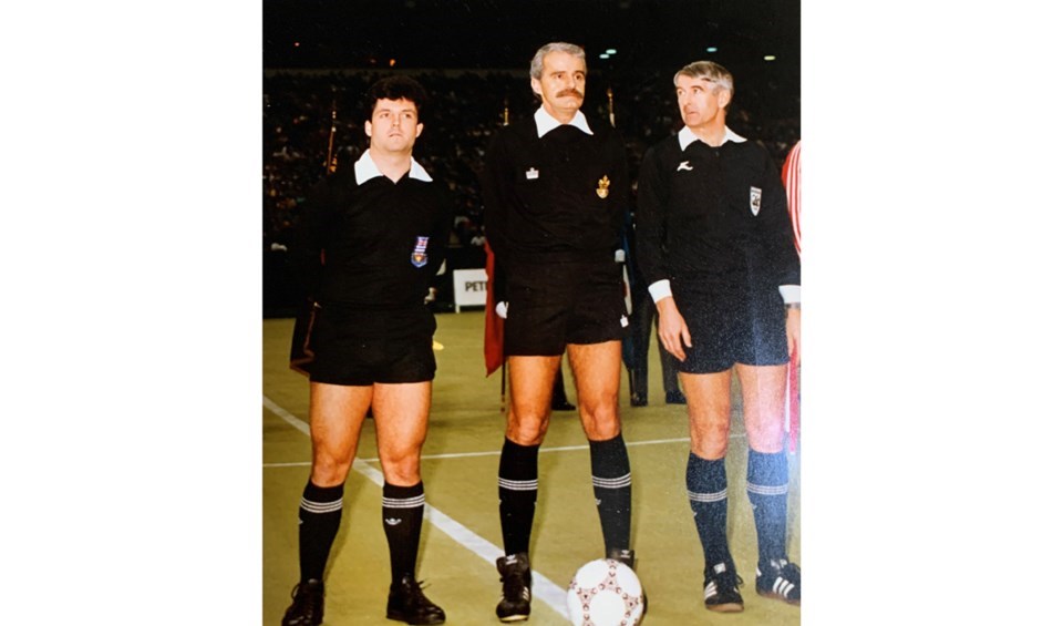 Bob Allen (centre) refereeing the Canada vs Paraguay game at B.C. Place