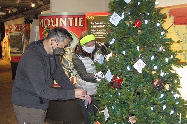 Richmond Amateur Radio Club members decorate their tree at the Gulf of Georgia Cannery. 