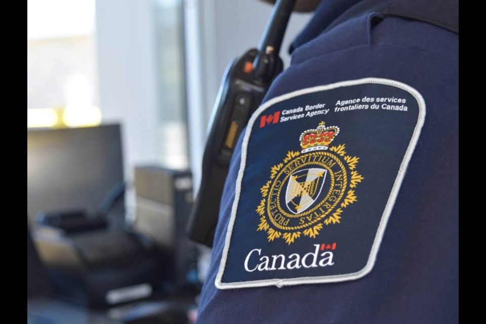 The Canada Border Services Agency badge.