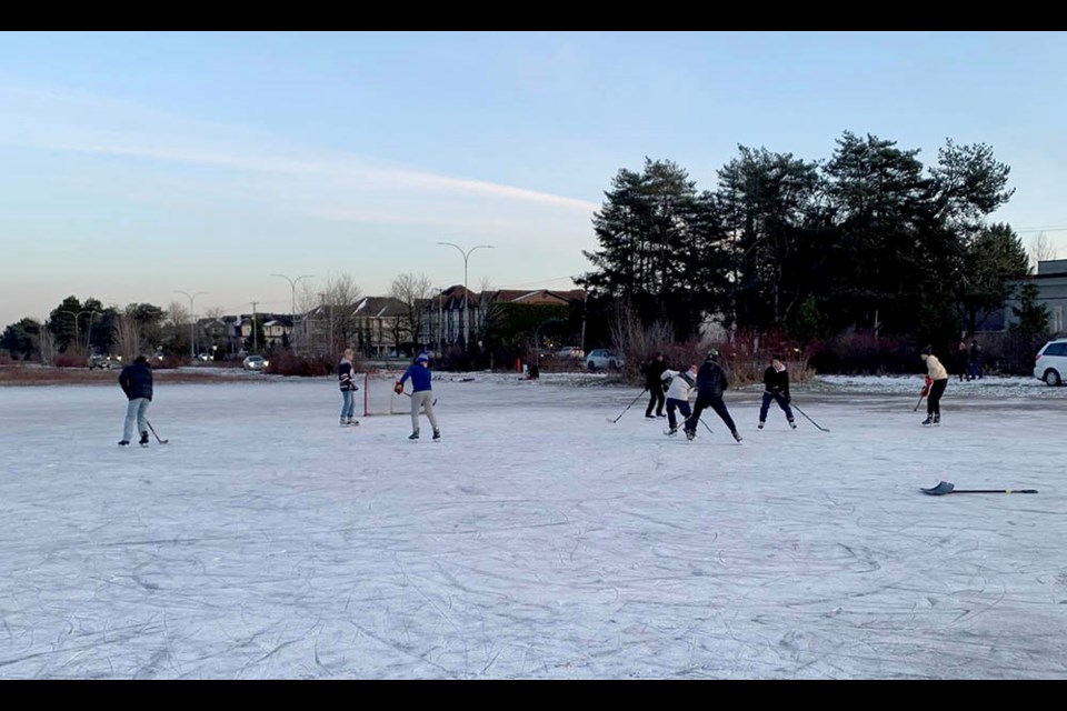 A hockey game was being played on a frozen pond at Garden City Lands in Richmond.