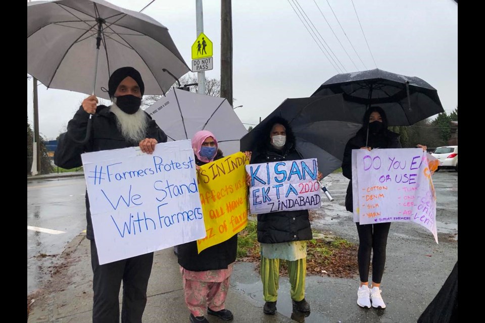 Demonstraters gathered at the corner of No. 5 and Cambie roads this week in solidarity with farmers in India, who are protesting a trio of new agricultural laws. Submitted photo by Sonia Panda