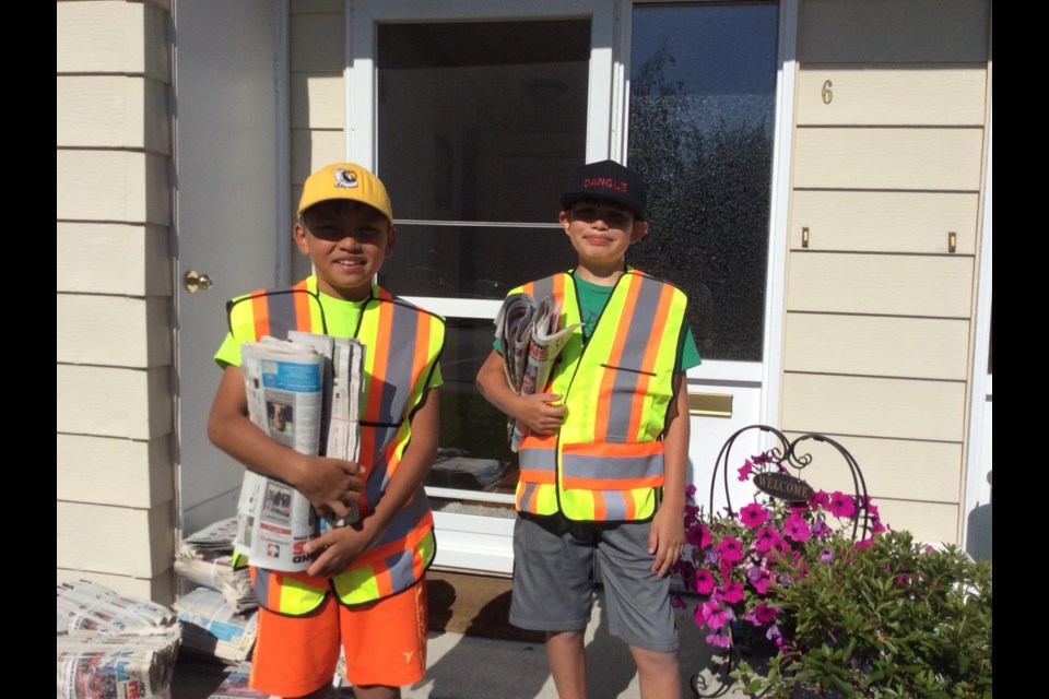 Patrick and Christian Higgs Torres have been delivering the newspaper for six years and five months.