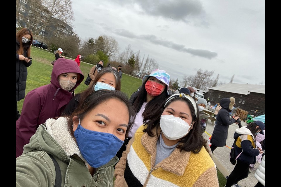 Richmond resident Pamela Bagtas (in the blue mask) with other fans at Steveston waiting for Korean celebrity Lee Minho.