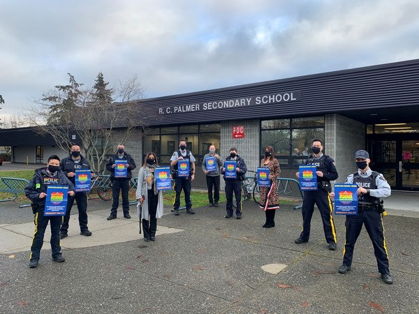 Richmond's Palmer secondary staff with Richmond RCMP holding the Safe Place program logo. Photo: Richmond RCMP