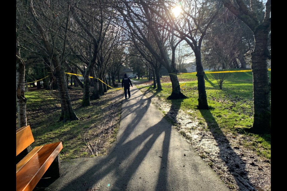 Police remove tape from the scene of a shooting in Steveston Community Park. The shooting, which left one man dead, is believed to be targeted and gang-related.
