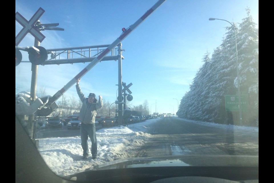 The weather chaos leaked into the fourth day, when drivers had to get out and lift the railway crossing arm themselves