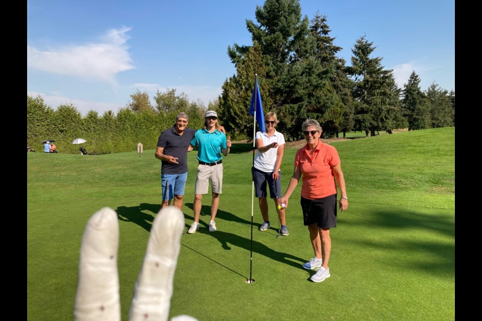 Janey Gaspar (right) after bagging her second hole-in-one during the same round of golf