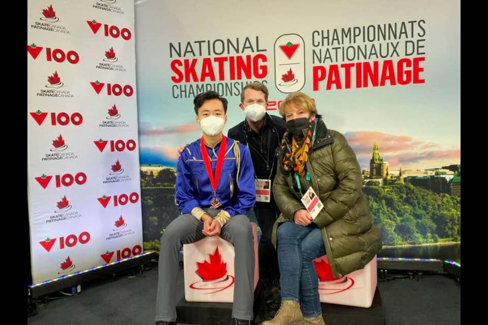 Connaught skater Wesley Chiu, with his coaches, Keegan and Eileen Murphy, after winning his bronze medal at the nationals