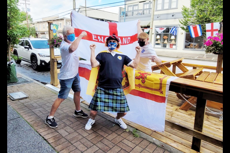 Richmond News reporter and Scotland native Alan Campbell (centre) comes face to face with Iain MacKelworth (right) and Andy Stokes, both die-hard England fans