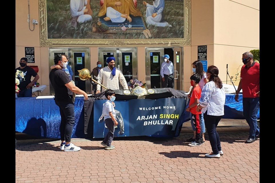 Arjan Bhullar with a local family.