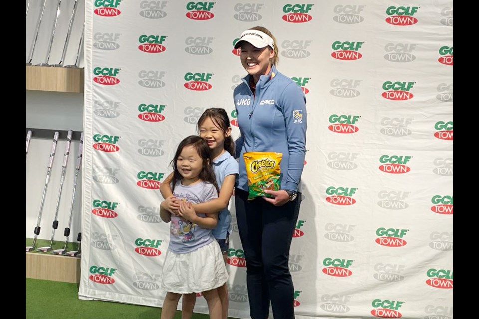 Brooke Henderson met some of her young fans at Golf Town in Richmond on Monday
