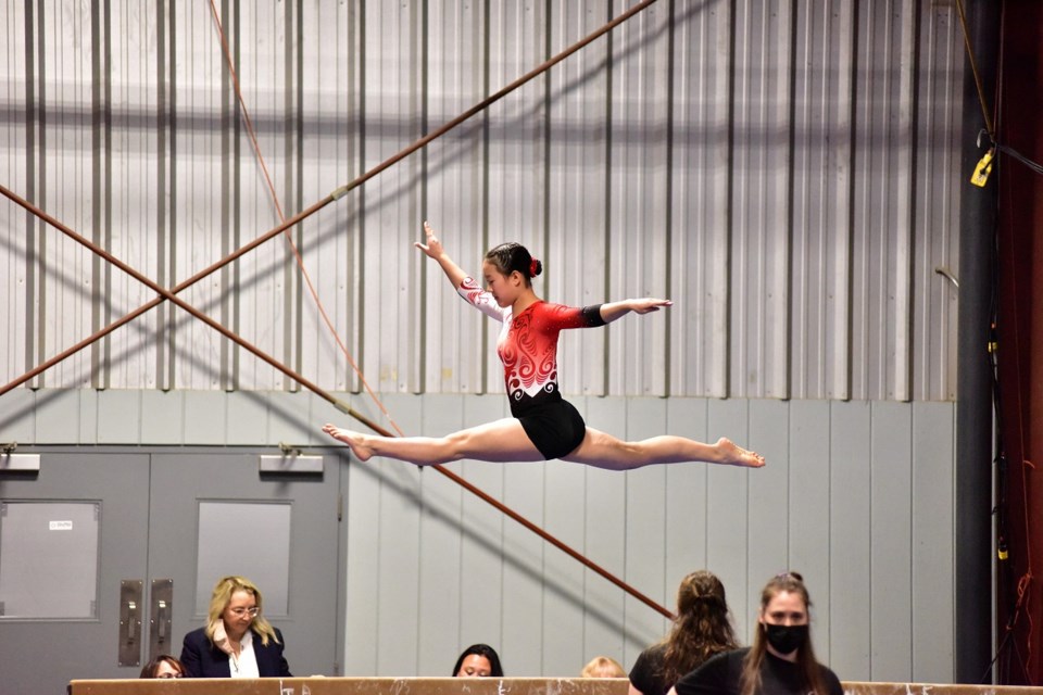 Richmond gymnast Naomi Tsang on the beams at the Western Championship qualifers.