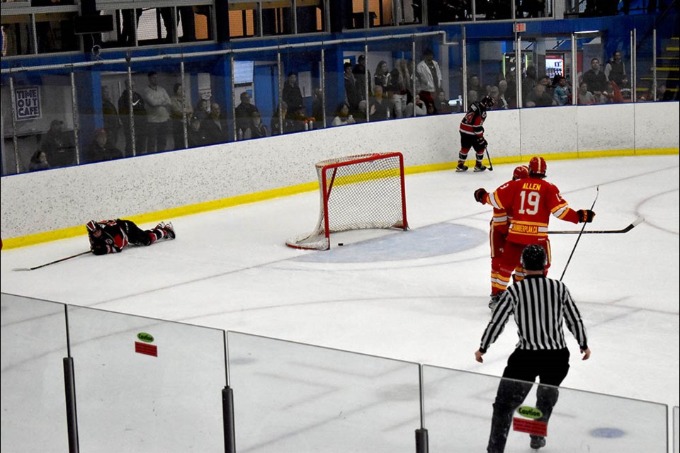 An empty-net goal cemented the Ridge Meadows' Flames win over the Richmond Sockeyes in Game 7.