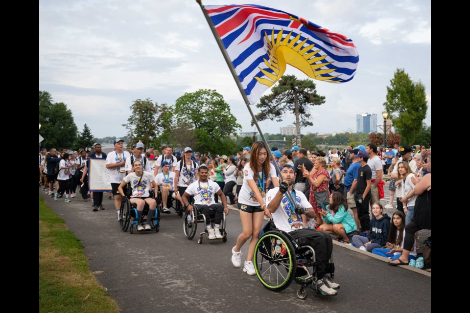 Golfer Tina Jiang was accompanied by Vancouver’s Leo Sammarelli, from athletics at the closing ceremony in Niagara, On.