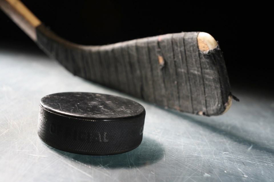 hockey stick and puck