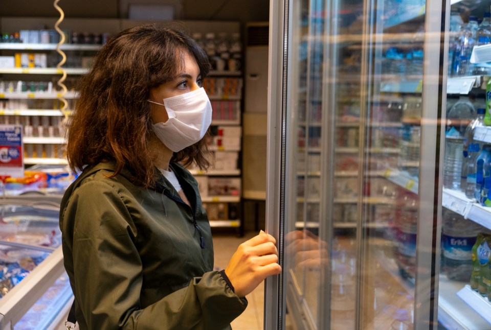 woman wearing face mask in store