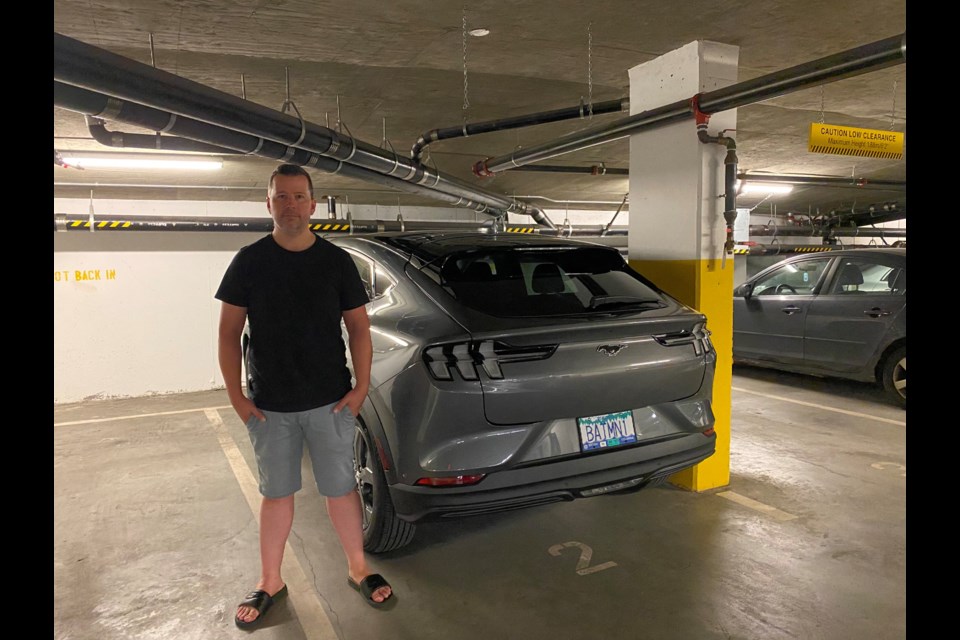 Murray Wasylnuk, with his electric Mustang that he's not allowed to charge up at his rental building