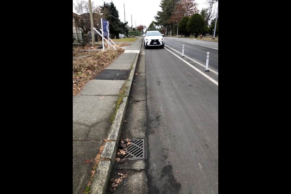 A car in a bike lane on Granville Avenue.