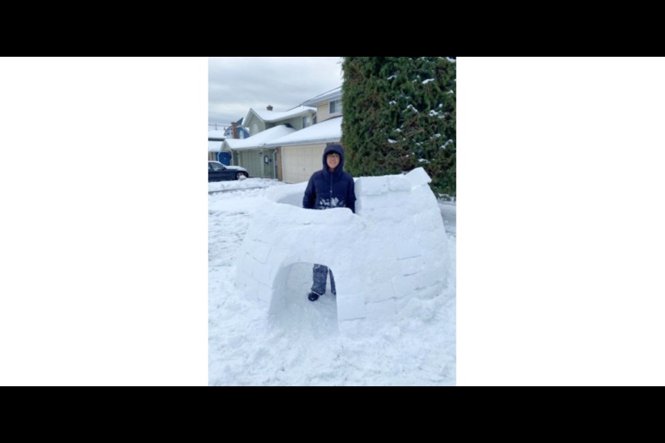 Russell Ng, 16, built his first igloo during last week's snowstorm.