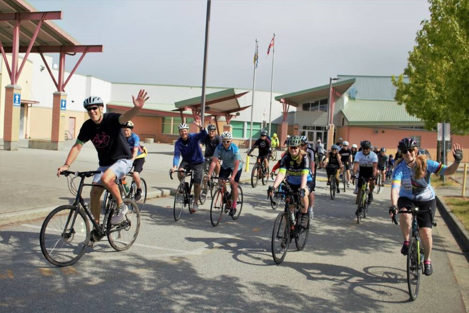 Dozens of cyclists set off from Burnett secondary on Saturday morning to raise funds to support local students. (Vikki Hui) 